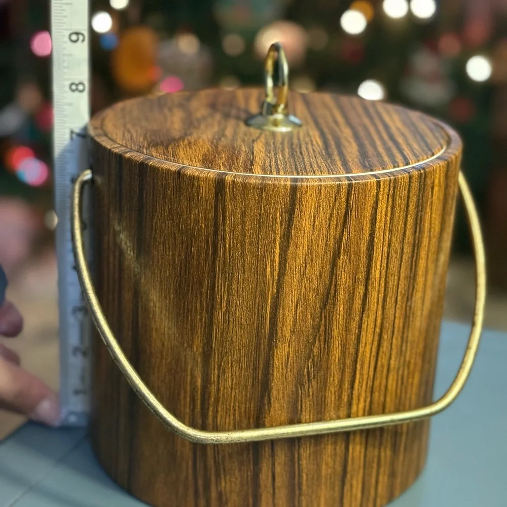 Vintage faux wood ice bucket, likely produced in the 1960s or 1970s